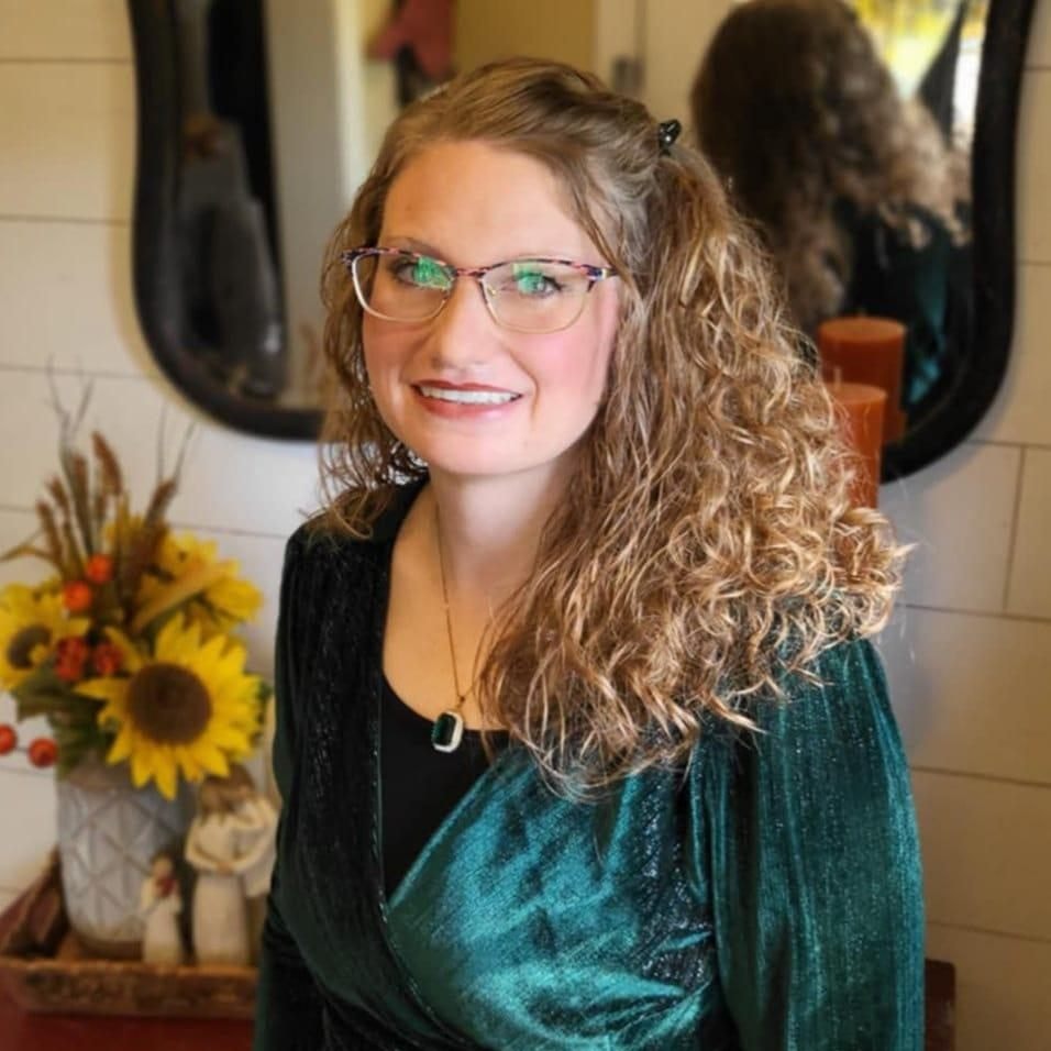 Amanda Elaine West, writer, in a cottage garden